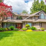 front of luxury home with landscaping