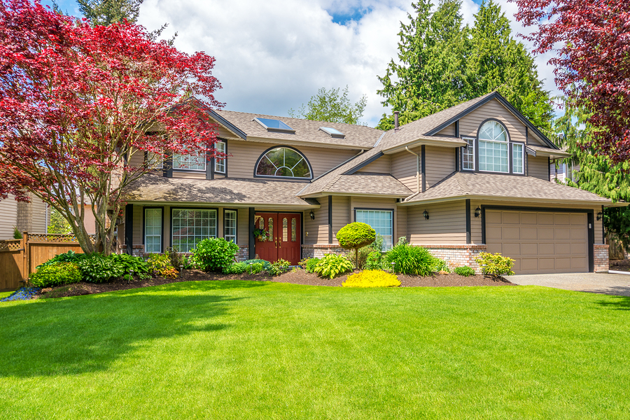 front of luxury home with landscaping