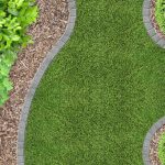 stone lined manicured lawn