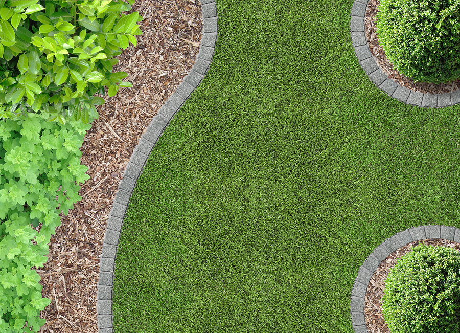 stone lined manicured lawn