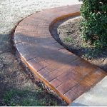 Red brick pathway through garden