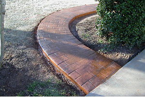 Red brick pathway through garden