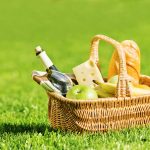 picnic basket with food and wine